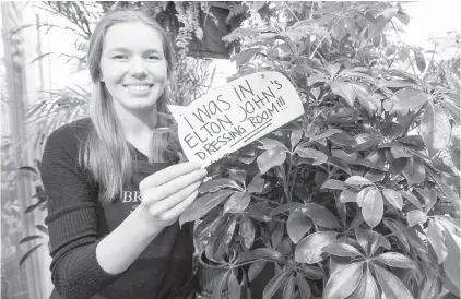  ??  ?? Hanna Carter with some plants that adorned Elton John’s dressing room at Save-on-Foods Memorial Centre last weekend. Brown’s The Florist on Fort Street is selling the potted ficus and palm trees, which were rented to the musician.