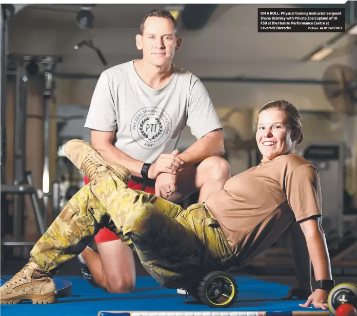  ?? Picture: ALIX SWEENEY ?? ON A ROLL: Physical training instructor Sergeant Shane Bramley with Private Zoe Copland of 10 FSB at the Human Performanc­e Centre at Lavarack Barracks.