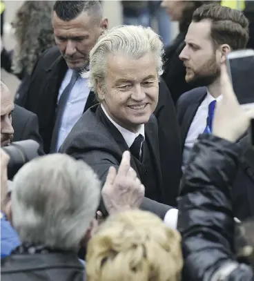  ?? JOHN THYS / AFP / GETTY IMAGES ?? Dutch Freedom Party leader Geert Wilders meets supporters in Heerlen on Saturday. The far-right candidate has attracted attention for his anti-Muslim rhetoric.