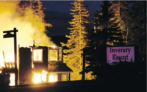  ?? PHOTOS: ANDREW BROOKS / THE VICTORIA STANDARD / THE CANADIAN PRESS ?? The main lodge of the Inverary Resort inn on Cape Breton’s Bras d’or Lakes was destroyed by a raging fire early Thursday morning.