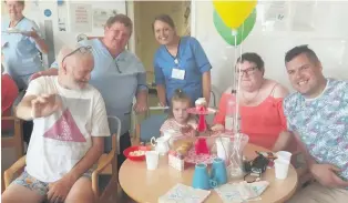  ??  ?? Staff and visitors enjoyed the occasion in ward 4 at Stirling Community Hospital