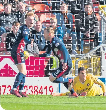  ??  ?? Ross County’s Billy Mckay celebrates the second of his three goals at Tannadice