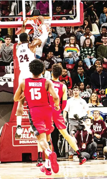  ??  ?? Mississipp­i State’s Abdul Ado (24) slams the basketball through the hoop during last year’s meeting against Georgia at Humphrey Coliseum. (Photo by Cody Jenkins, SDN file)