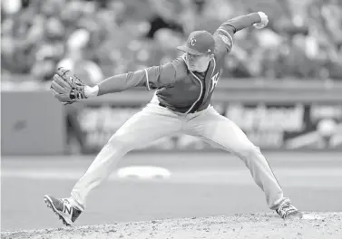  ?? AP Photo/Tony Dejak ?? Kansas City Royals Hill delivers in the eighth inning of a home opener baseball game against the relief pitcher Tim ■ Cleveland Indians on Friday in Cleveland.