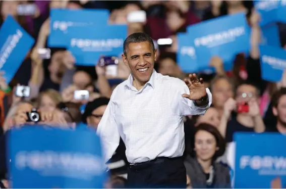  ?? ?? President Barack Obama waves as he is introduced at a campaign event Saturday, Nov. 3, 2012, in Milwaukee. Obama, a Democrat, had a 48% approval rating when he announced his reelection campaign on April 4, 2011, and defeated Mitt Romney, a Republican. Photo: Morry Gash, AP File