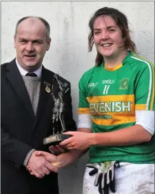  ??  ?? Player of the match, Tourlestra­ne’s Katie Walsh receives her trophy from Liam McDonagh, Connacht Ladies President.