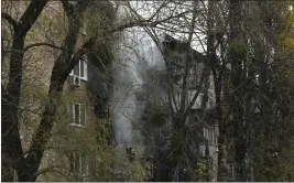  ?? ANDREW KRAVCHENKO — THE ASSOCIATED PRESS ?? Russian shelling caused damage to this building Tuesday in Kyiv, Ukraine.