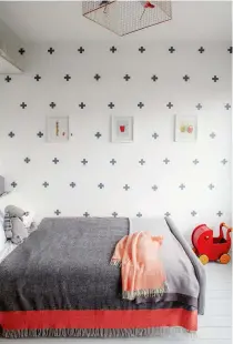  ??  ?? BEDROOM Cross wall stickers enliven a plain wall. Scandi-style cross decals, £3.49 for £68, Etsy. Try Graham and Green’s Voliéres bird cage pendant, £425