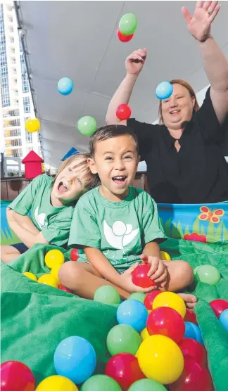  ?? Picture: GLENN HAMPSON ?? Isaac O'Connor-McCoy and Leo Robb-Smythe, both 4, try out the ball pit at the RISE Early Learning Centre under the watchful eye of manager Rebecca Gunn.