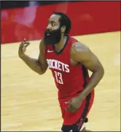  ?? Associated Press ?? BIG THREE
The Rockets’ James Harden reacts to a basket during the first quarter on Sunday in Houston, Texas. Harden was traded to the Nets on Wednesday. Harden joins Kevin Durant and Kyrie Irving in Brooklyn, but can they make it work?