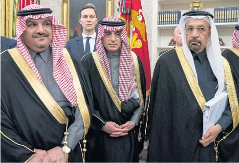  ??  ?? IN TRADITIONA­L GARB: Jared Kushner, centre, looks on as President Donald Trump met Crown Prince Mohammed bin Salman of Saudi Arabia, at the White House in Washington, in March.