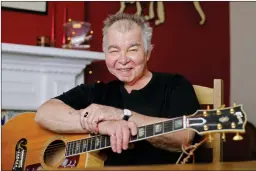  ?? AP PHOTO/MARK HUMPHREY ?? In this June 20 photo, John Prine poses in his office in Nashville, Tenn. The former Chicago mailman has become an affable songwritin­g guru for many of Nashville’s talented young artists and his songbook, “Beyond Words,” released in April, features...