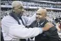  ?? NICK WASS — THE ASSOCIATED PRESS FILE ?? In this March 9, 2013, file photo, former Georgetown coach John Thompson Jr., left, congratula­tes his son Georgetown head coach John Thompson III, right, after the Hoya’s 61-39 win over Syracuse in an NCAA college basketball game in Washington. John Thompson, the imposing Hall of Famer who turned Georgetown into a “Hoya Paranoia” powerhouse and became the first Black coach to lead a team to the NCAA men’s basketball championsh­ip, has died. He was 78 His death was announced in a family statement Monday., Aug. 31, 2020. No details were disclosed.