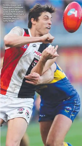  ?? ?? St Kilda skipper Jack Steele gets a handpass away against West Coast at Perth Stadium on Sunday. Steele had a career-high 40 disposals. Pictures: Getty Images