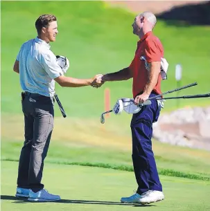  ?? ADOLPHE PIERRE-LOUIS/JOURNAL ?? Sam Saunders, left, is congratula­ted by second-place finisher Jeff Burton after the final round of the New Mexico Open on Thursday.