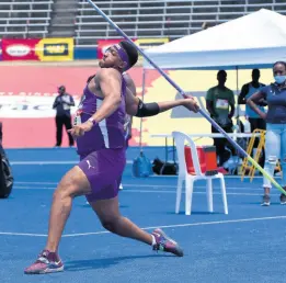  ??  ?? Akeel Hanchard from Kingston College on his way to winning the Boys Javelin Open event at the ISSA/GraceKenne­dy Boys and Girls’ Athletics Championsh­ips at the National Stadium yesterday. Hanchard’s winning mark was 62.93m