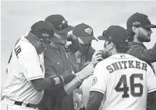  ?? KEVORK DJANSEZIAN/GETTY ?? The Astros celebrate after closing out the A’s in the ALDS on Thursday.