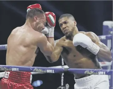  ??  ?? 0 Anthony Joshua lands a punch on Kubrat Pulev on his way to victory over the Bulgarian.