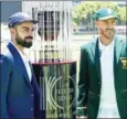  ?? AFP ?? Captains Virat Kohli (left) and Faf du Plessis pose with the Freedom Trophy, which is awarded to the winners of India-South Africa
Test series.