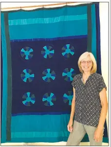  ?? Courtesy Photo ?? Marti Olesen of Ponca will share her latest quilt, “Buffalo River Blues,” at Saturday’s Ozark Quilt Fair. Organizer Carolyn Reno expects at least 22 entrants displaying some 100 quilts on the Shiloh Museum grounds in Springdale.