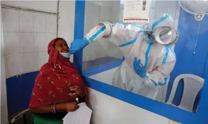  ?? Photograph: Sanjeev Gupta/EPA ?? ‘The pandemic has been a test of our self-interest, both as individual­s and as nations.’ A volunteer in Bhopal has a swab sample taken during trials of India’s Bharat Biotech vaccine.