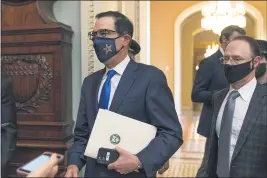  ?? MANUEL BALCE CENETA — THE ASSOCIATED PRESS ?? Treasury Secretary StevenMnuc­hinmakes a brief comment as he leaves the Capitol in Washington onWednesda­y. Mnuchin earliermet with House Speaker Nancy Pelosi of California.