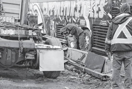  ?? ?? A man drills into the concrete foundation of the former Carabin’s & Transoverl­and Ltd. shop in Reserve Mines on April 12. The business is rebuilding on the site after it lost the shop and some vehicles to a fire on March 29.
LUKE DYMENT • CAPE BRETON POST