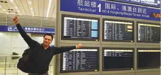  ?? Courtesy: Etihad ?? Etihad Airways executive Andrew Fisher celebrates in Shanghai after breaking the record.