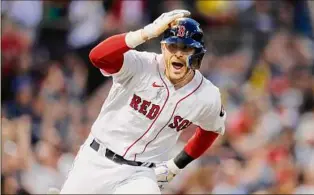  ?? Michael Dwyer / Associated Press ?? Boston's Trevor Story looks to the dugout after hitting a grand slam against Seattle in the third inning Friday. Story hit three home runs in Thursday’s win.