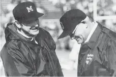  ?? AP FILE PHOTO ?? Coaches Bo Schembechl­er of Michigan, left, and Woody Hayes of Ohio State matched wits from 1969 to 1978.