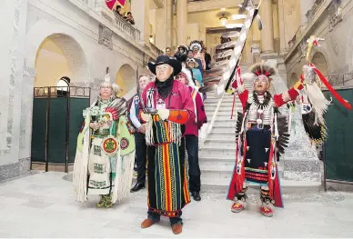  ?? DAVID BLOOM / POSTMEDIA NEWS ?? The Grand Entry Procession makes its way into the Alberta Legislatur­e in Edmonton, where Premier Rachel Notley later apologized to survivors and families of the ’60s Scoop. Alberta is the second province to offer a formal apology — Manitoba did so in...