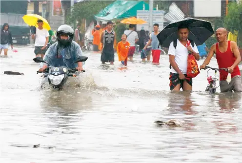  ?? SUNSTAR FILE ?? FLOODING PROBLEM. Rivers clogged with garbage and made narrow by human habitation contribute to the flooding problem in Metro Cebu. /