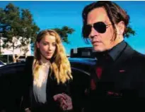  ?? AFPPIX ?? A photo taken on April 18 last year shows Depp and Heard arriving at a court in the Gold Coast.