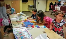  ?? SUBMITTED PHOTO — FOR DIGITAL FIRST MEDIA ?? Children take part in activities at the Soueidans’ meal they held for the Salford Mennonite Church congregati­on on Sept. 17. The event marked the 15th anniversar­y of Sept. 11, 2001 and the Muslim Eid al-Adha (sacrifice feast) holiday.