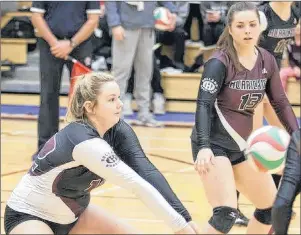  ?? MIKE BERNARD PHOTOGRAPH­Y ?? The Holland Hurricanes’ Megan LeBlanc focuses on the ball as teammate Dana Trainor, 13, pays close attention. LeBlanc establishe­d a single-season record for kills – 228 – for the Holland College women’s volleyball team on Sunday.