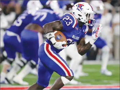  ?? Tom Morris/Louisiana Tech Sports Informatio­n ?? Dancy finalist for award: Louisiana Tech running back and former Junction City standout Jaqwis Dancy carries the ball during a game earlier this season. Dancy has been selected as one of four finalists for the 2018 Uplifting Athletes Rare Disease...