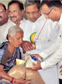  ??  ?? SIDDARAMAI­AH presiding over the launch of the government’s Anna Bhagya scheme in May 2015. It is paradoxica­l that this scheme failed to translate into votes.