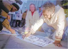  ?? BARBARA HADDOCK TAYLOR/BALTIMORE SUN ?? Geraldine Jackson, mother of Garrett “Scooter” Jackson, takes part in a 1996 rally to protest police shootings.