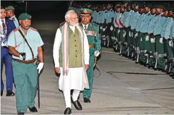  ?? (AFP) ?? Prime Minister Narendra Modi inspects the guard of honour upon his arrival at Port Moresby Internatio­nal Airport on Sunday