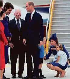  ?? AP ?? Canadian Prime Minister Justin Trudeau (back left) greets Prince William as Governor General David Johnston looks on in Victoria, British Columbia, on Saturday.