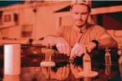  ?? ?? Ecologist Crawford Drury collects coral eggs at the Institute of Marine Biology in Kaneohe, Hawaii.