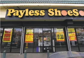  ?? Mark Ralston / AFP / Getty Images ?? Payless ShoeSource stores, including this one in Los Angeles, begain liquidatin­g inventory over the weekend.