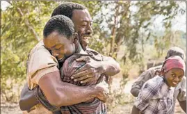  ?? ILZE KITSCHOFF/NETFLIX ?? Chewitel Ejiofor, left, and Maxwell Simba appear in “The Boy Who Harnessed the Wind.”