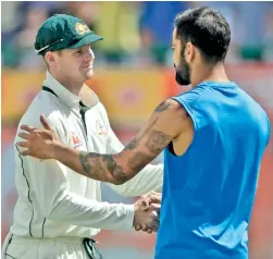  ??  ?? Virat Kohli shakes hands with Australia captain Steve Smith after India won the Border-Gavaskar trophy.