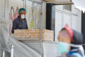  ?? (Mohammed Salem/Reuters) ?? A PALESTINIA­N MAN works at a bakery in Gaza City yesterday.