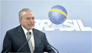  ?? RICARDO BOTELHO/THE ASSOCIATED PRESS ?? Brazil’s President Michel Temer speaks during a national address at the Planalto presidenti­al palace in Brasilia, Brazil on Thursday. Temer rejected calls for his resignatio­n.