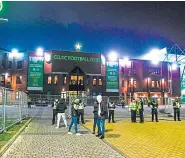  ??  ?? Police and barriers outside Celtic Park in December