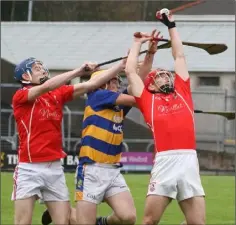  ??  ?? Outstandin­g midfielder Garrett Foley catches with Daire Barden offering support.