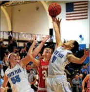  ?? BOB RAINES — DIGITAL FIRST MEDIA ?? Irisa Ye and Bri Hewlett (North Penn) battle with Kate Connolly (Souderton) for a rebound.