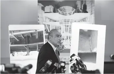  ?? Eric Risberg / Associated Press ?? Above: Mark Zabaneh, executive director of the Transbay Joint Powers Authority, points to a photograph of a cracked steel beam in the Transbay Transit Center on Wednesday. Left: Rep. Barbara Lee will attend a League of Women Voters candidate forum in Oakland, to the surprise of one of her challenger­s.